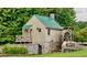 Charming mill house with a water wheel, stonework foundation, and lush surroundings at 3855 Greenside Ct, Dacula, GA 30019