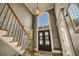 Grand foyer with high ceilings, staircase, and large windows at 3855 Greenside Ct, Dacula, GA 30019