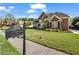 Well-manicured lawn with lush landscaping and a charming mailbox at 3855 Greenside Ct, Dacula, GA 30019