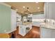 Bright kitchen with white cabinets, granite countertops, stainless steel appliances, and a large island at 3855 Greenside Ct, Dacula, GA 30019
