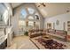 Spacious living room featuring large windows and vaulted ceilings at 3855 Greenside Ct, Dacula, GA 30019