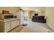 Spacious living area with a kitchenette, seating area, and plenty of space for entertaining at 3855 Greenside Ct, Dacula, GA 30019