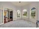 Bright living room with large windows and neutral carpet at 3855 Greenside Ct, Dacula, GA 30019