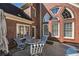 Brick home with outdoor patio features a built-in grill and ample space for outdoor entertaining at 3855 Greenside Ct, Dacula, GA 30019