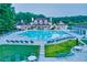 Resort-style pool area surrounded by lounge chairs, manicured lawns, and lush greenery at 3855 Greenside Ct, Dacula, GA 30019