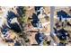 An aerial view of a property with a well-maintained lawn and a driveway at 4197 Trotters Way Dr, Snellville, GA 30039