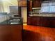 Traditional kitchen with granite countertops, wood cabinets and stainless steel sink at 4197 Trotters Way Dr, Snellville, GA 30039
