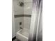 Modern bathtub and shower with elegant shower curtain at 1074 Hobson Sw St, Atlanta, GA 30310