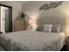Stylish bedroom with a comfortable queen bed, patterned bedding and a chest of drawers at 1074 Hobson Sw St, Atlanta, GA 30310