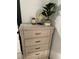 Light wood chest with drawers and bronze handles at 1074 Hobson Sw St, Atlanta, GA 30310