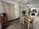 Bright dining area with wood table and chairs, and a view into the kitchen at 1074 Hobson Sw St, Atlanta, GA 30310