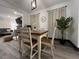 Cozy dining area featuring a wooden table, woven chairs, and natural light at 1074 Hobson Sw St, Atlanta, GA 30310