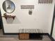 Entryway featuring a decorative bench, mirror, and wall-mounted hooks at 1074 Hobson Sw St, Atlanta, GA 30310