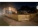 Nighttime view of homes featuring freshly painted exteriors and new wooden fences, enhancing curb appeal and privacy at 1074 Hobson Sw St, Atlanta, GA 30310