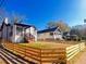 View of a charming home featuring a new wooden fence, providing both privacy and curb appeal in a peaceful setting at 1074 Hobson Sw St, Atlanta, GA 30310