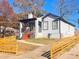 Charming home with a picket fence, showcasing the landscaped front yard and inviting exterior at 1074 Hobson Sw St, Atlanta, GA 30310