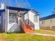 Charming home featuring a covered porch with painted steps and a landscaped front yard at 1074 Hobson Sw St, Atlanta, GA 30310