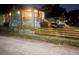 Nighttime view of homes featuring freshly painted exteriors and new wooden fences, enhancing curb appeal and privacy at 1074 Hobson Sw St, Atlanta, GA 30310