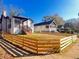 Charming home with a picket fence, showcasing the landscaped front yard and inviting exterior at 1074 Hobson Sw St, Atlanta, GA 30310