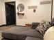 Comfortable living room featuring a gray sofa with decorative pillows and modern décor at 1074 Hobson Sw St, Atlanta, GA 30310
