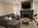 Cozy living room with a fireplace and comfortable sectional sofa at 1074 Hobson Sw St, Atlanta, GA 30310