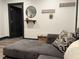 Comfortable living room featuring a gray sofa with decorative pillows and modern décor at 1074 Hobson Sw St, Atlanta, GA 30310