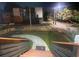Exterior view of a staircase and landscaped backyard area with a path leading toward the house at night at 1074 Hobson Sw St, Atlanta, GA 30310