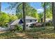 Lush backyard view showing a sprawling yard, mature trees, and the home's rear exterior at 5452 Tally Green Dr, Marietta, GA 30068