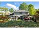 Expansive backyard view featuring a well-maintained lawn, patio, and a glimpse of the home's exterior at 5452 Tally Green Dr, Marietta, GA 30068