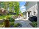 Backyard with a stone patio, water feature, grill, and access to the house at 5452 Tally Green Dr, Marietta, GA 30068