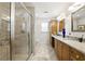 Bright bathroom featuring a glass enclosed shower and double vanities at 5452 Tally Green Dr, Marietta, GA 30068