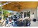 Relaxing covered patio with stylish furniture, ceiling fan, and easy access to the home's interior at 5452 Tally Green Dr, Marietta, GA 30068