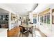 Charming dining area featuring a round table and large windows overlooking a beautifully landscaped yard at 5452 Tally Green Dr, Marietta, GA 30068