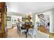 Elegant dining room with hardwood floors, light gray walls, and open access to other living spaces at 5452 Tally Green Dr, Marietta, GA 30068