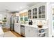 Stylish kitchen with white cabinets, stainless steel appliances, and a cozy breakfast nook with backyard views at 5452 Tally Green Dr, Marietta, GA 30068