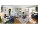 Cozy living room with stylish decor, comfortable seating, and open access to kitchen and dining area at 5452 Tally Green Dr, Marietta, GA 30068
