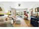Bright living room with hardwood floors, comfortable seating, and access to an outdoor patio at 5452 Tally Green Dr, Marietta, GA 30068