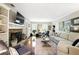 Spacious living room features a stone fireplace, built-in bookshelves, and ample seating for Gathering and guests at 5452 Tally Green Dr, Marietta, GA 30068