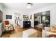 Cozy living room featuring hardwood floors, classic decor, and views into the kitchen and dining area at 5452 Tally Green Dr, Marietta, GA 30068