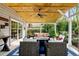 Covered outdoor patio with a ceiling fan, comfortable seating, and decorative lighting at 5452 Tally Green Dr, Marietta, GA 30068