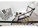 Carpeted staircase featuring a stylish gallery wall and a view of the foyer at 5452 Tally Green Dr, Marietta, GA 30068