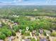 Aerial view of the home showcasing lush greenery and surrounding neighborhood at 5705 Twelve Oaks Dr, Cumming, GA 30028