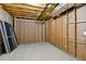 Unfinished basement showing the stud walls and the ceiling insulation at 5705 Twelve Oaks Dr, Cumming, GA 30028
