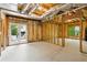 Unfinished basement featuring natural light, exposed utilities, and walk out to backyard at 5705 Twelve Oaks Dr, Cumming, GA 30028