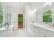 Bathroom with walk-in shower and double vanity at 5705 Twelve Oaks Dr, Cumming, GA 30028