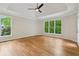Bedroom with hardwood floors and windows at 5705 Twelve Oaks Dr, Cumming, GA 30028
