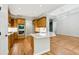 Eat-in kitchen with white countertops and wooden cabinets at 5705 Twelve Oaks Dr, Cumming, GA 30028