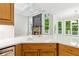Kitchen with stainless steel appliances and stone fireplace at 5705 Twelve Oaks Dr, Cumming, GA 30028