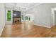 Spacious living room with hardwood floors, coffered ceiling, fireplace, and ample natural light at 5705 Twelve Oaks Dr, Cumming, GA 30028
