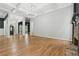 Spacious living room with coffered ceilings, stone fireplace and hardwood floors at 5705 Twelve Oaks Dr, Cumming, GA 30028